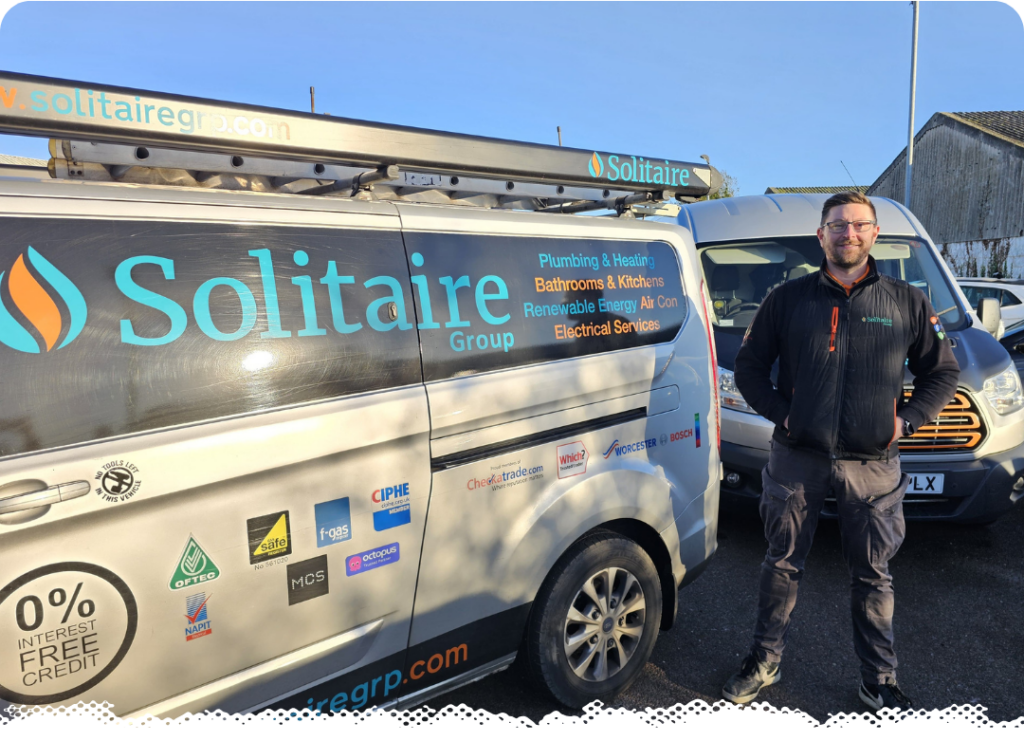 Solitaire Director Paul in front of work van